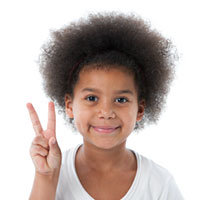 girl making the peace sign